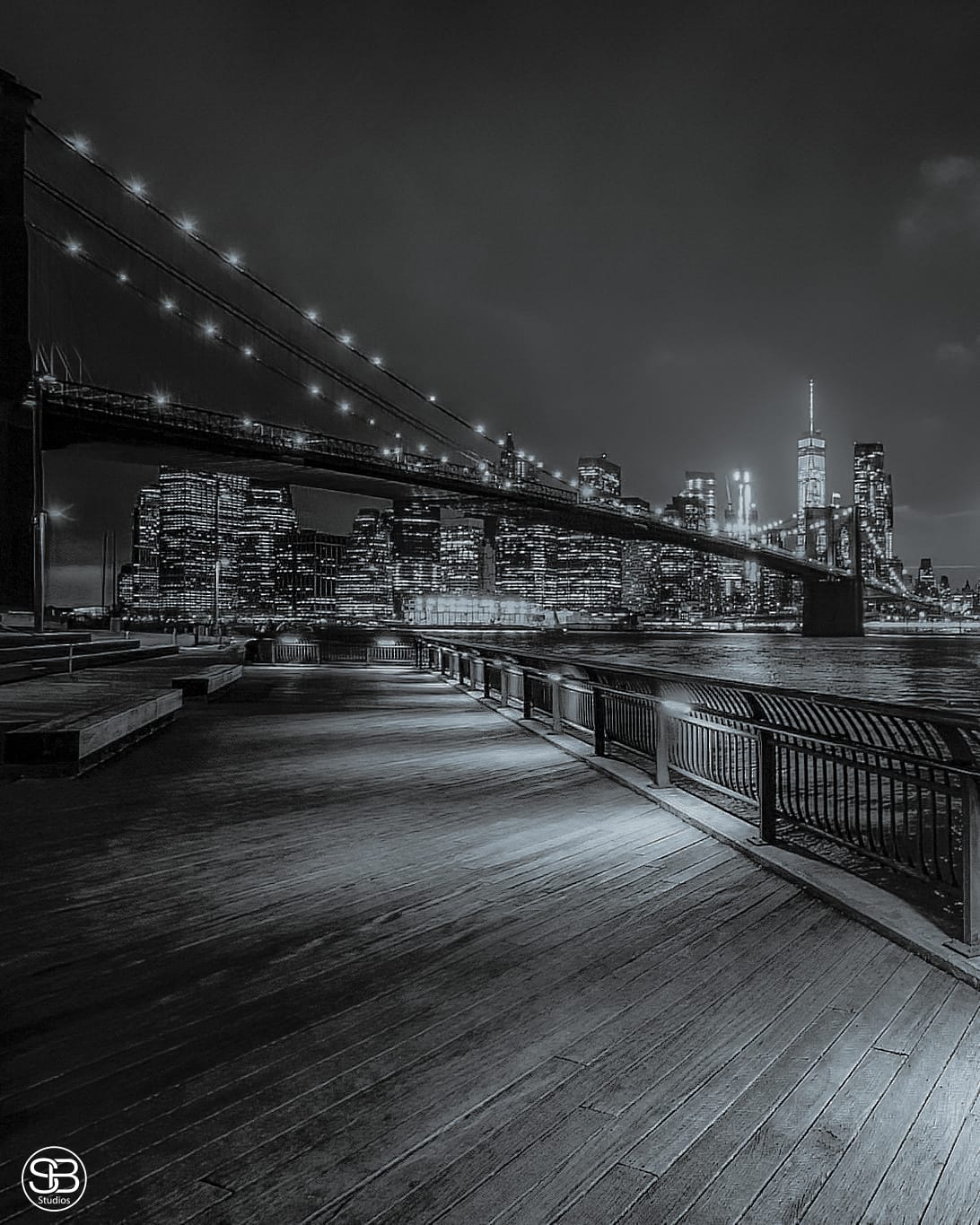 Iconic view of the New York City skyline and Brooklyn Bridge captured from the Brooklyn Bridge Park Christmas 2023